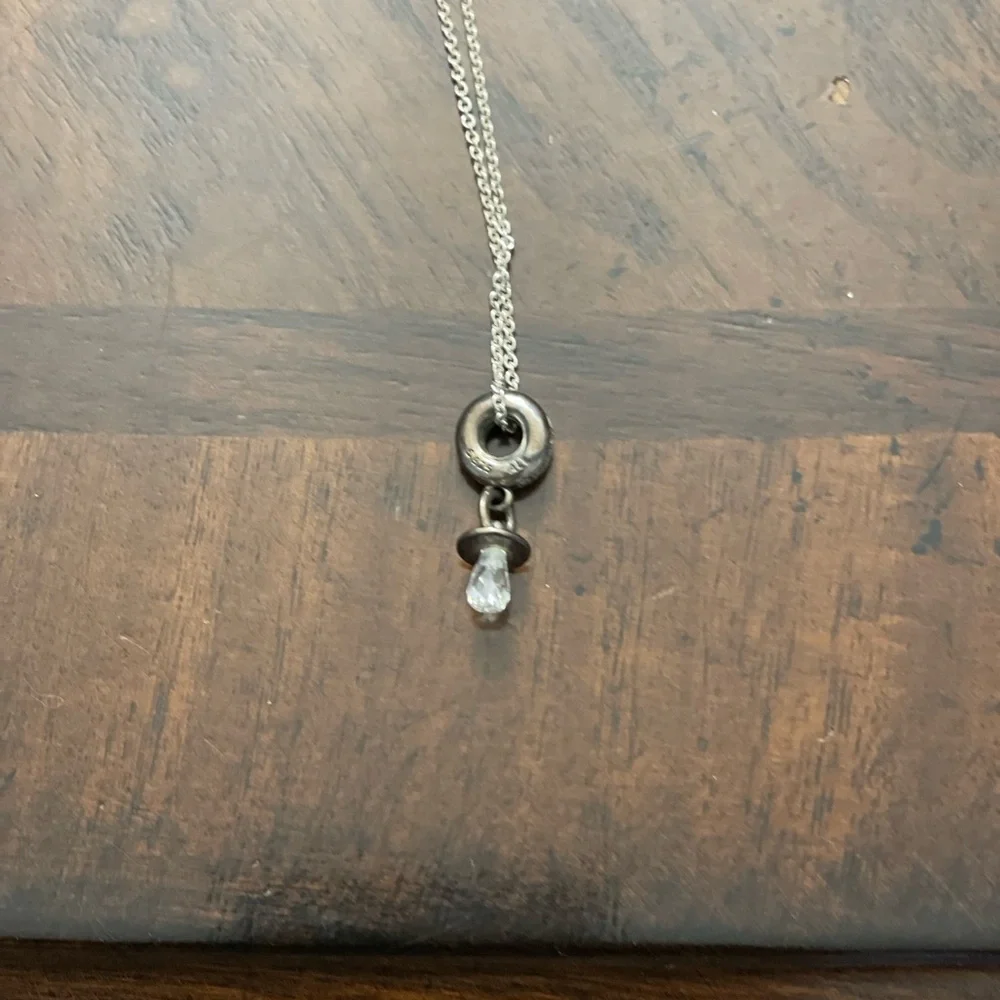 Silver necklace with a circle at end and pacifier at end of circle - Picture 4 of 6